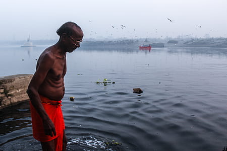 Man Stepping in the Body of Water thumbnail