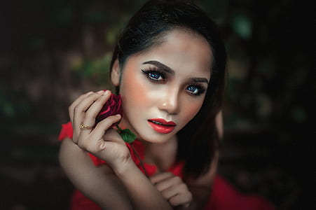 shallow focus photography of woman wearing red dress thumbnail