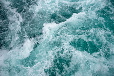 aerial view photography of sea waves at daytime thumbnail