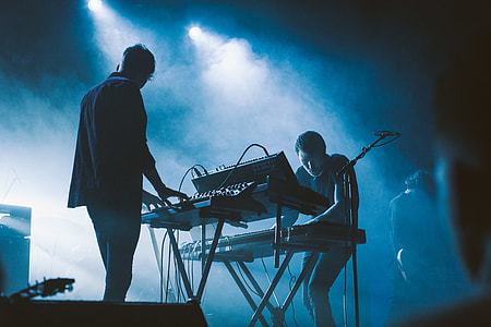 photo of two people using instruments thumbnail
