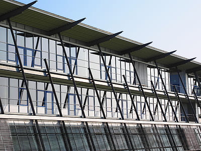Low Angle View of Office Building Against Sky thumbnail