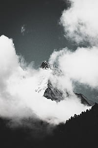 gray and black mountain surrounded by clouds thumbnail