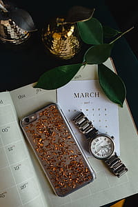 Home office desk with Macbook, iPhone, calendar, watch & organizer thumbnail