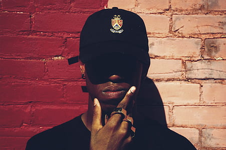 man wearing cap and brass knuckle thumbnail