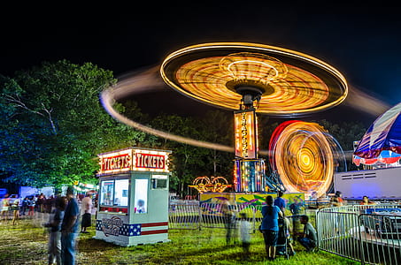 time-lapse photography of amusement park ride thumbnail