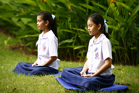 two girls in uniforms meditating thumbnail