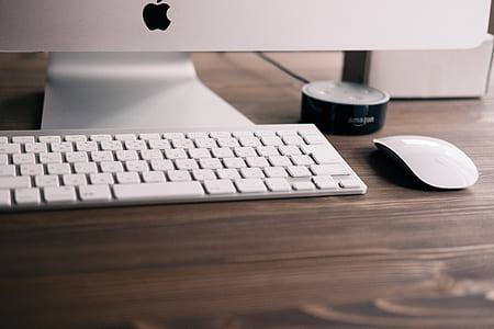 silver iMac beside Apple Wireless Magic Keyboard, and Apple Magic mouse thumbnail