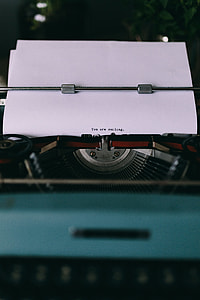 Closeup view of typing quotes on the old typewriter thumbnail