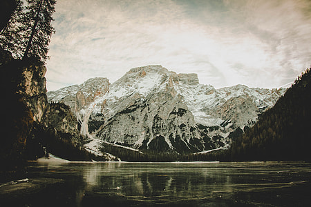 landscape photography of body of water and mountain thumbnail