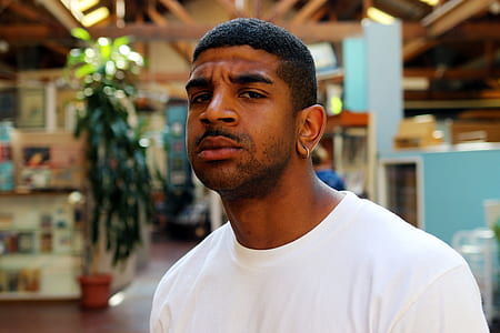 man wearing white crew-neck shirt thumbnail
