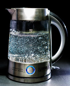 silver and clear electric kettle with bioling water thumbnail