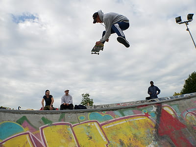 person wearing grey hoodie riding skateboard thumbnail