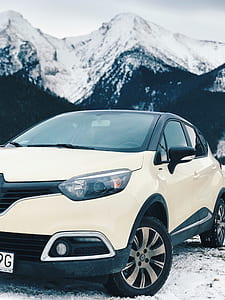 White Renault Clio 4 on Snow Covered Road thumbnail