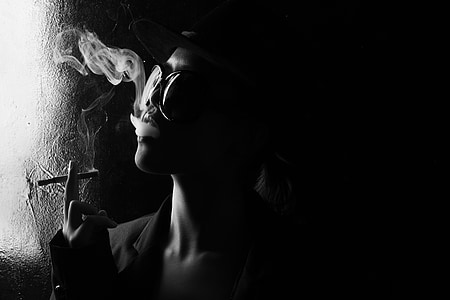 person smoking in grayscale photography thumbnail