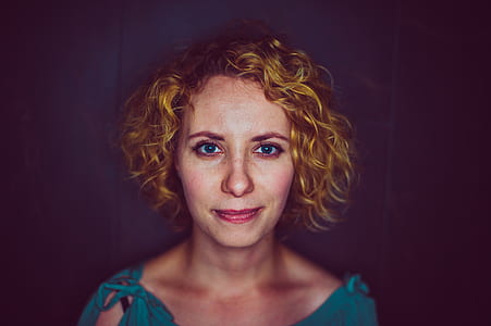 smiling woman in blue top posing for photo thumbnail