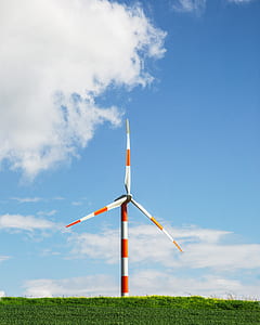 orange and white wind turbine taken at daytime thumbnail