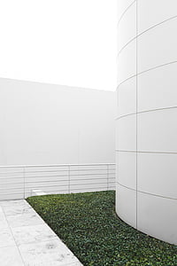 white painted wall near green grass thumbnail