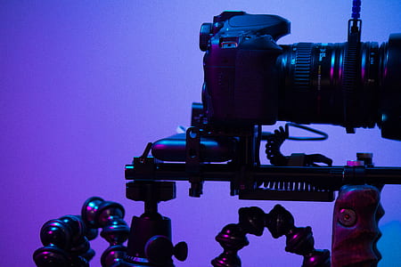 black DSLR camera on black tripod thumbnail