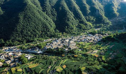 aerial photography of rural area with mountains during daytime thumbnail