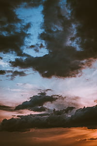 dark clouds during golden hour thumbnail