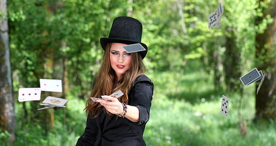 selective focus photography of magician in black long-sleeved top thumbnail