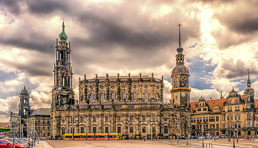 brown concrete structure under white clouds during daytime thumbnail