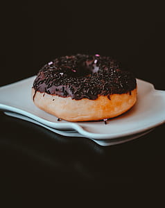 chocolate doughnut on white ceramic plate thumbnail
