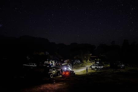 white SUV on road at night thumbnail