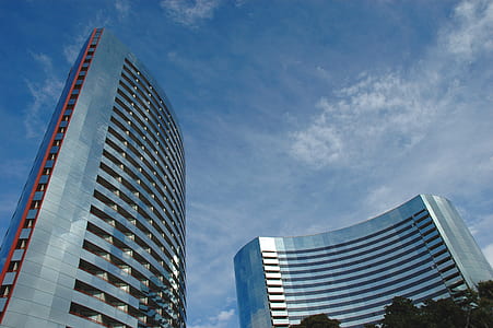 gray concrete building under blue sky thumbnail