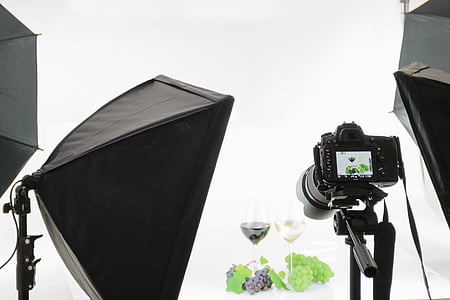 photoshoot of wine glasses filled with green and purple grape wines with grapes thumbnail