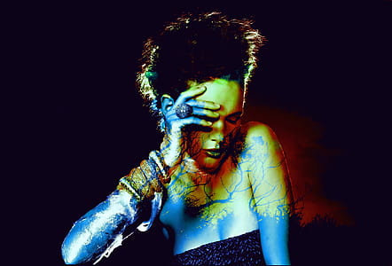 photo of woman holding fourhead thumbnail