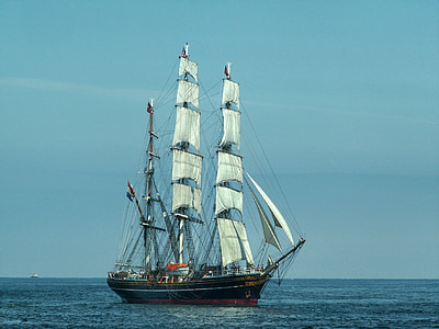 white and black sailing ship on sea thumbnail