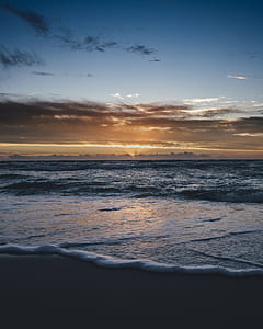 seashore under white clouds thumbnail