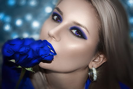 woman holding blue rose flower thumbnail