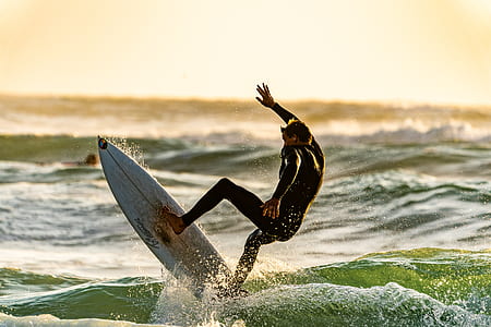 male surfer surfing and doing tricks thumbnail