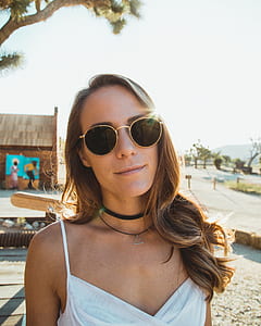 photography photo of woman in white spaghetti strap top thumbnail