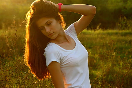 woman wearing white crew-neck cap-sleeved shirt leaning her head to her right thumbnail