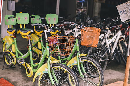 two black-and-yellow city bicycles thumbnail
