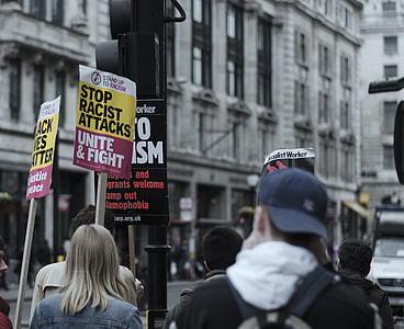people walking on street while protesting thumbnail