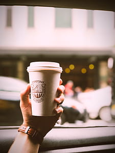 person holding Stumptown paper cup thumbnail