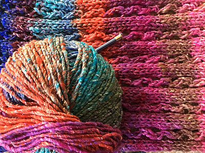 multicolored yarn on crochet textile thumbnail