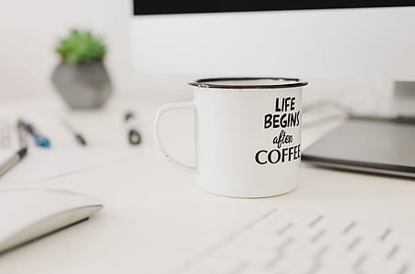 white and black ceramic coffee mug thumbnail