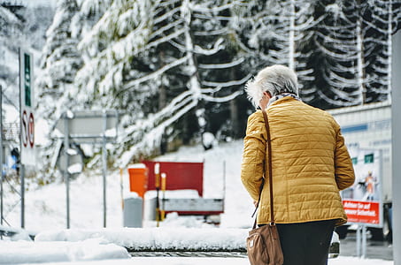 selective focus photography of woman outdoors thumbnail