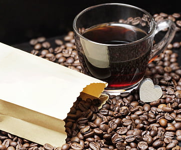 glass of coffee on coffee beans thumbnail