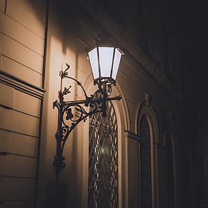 turned on black steel framed sconce thumbnail