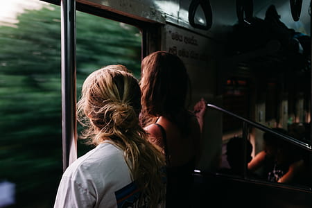 women standing inside train thumbnail