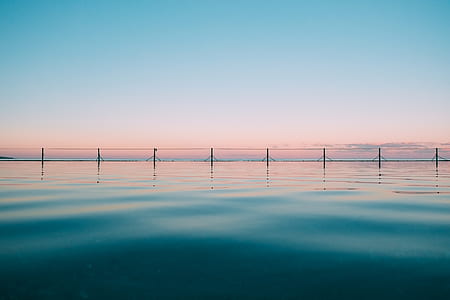 photography of blue body of water under sky thumbnail
