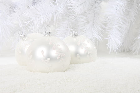 close-up photography of three white baubles near white garland thumbnail