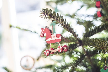 macro photography of red horse Christmast decor thumbnail