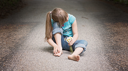 girl sitting in the middle of the road thumbnail